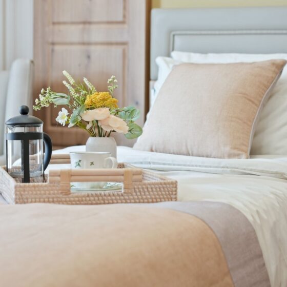 Comfortable bedroom at Heathview Rose care home, om Solihull with fresh bedding and a tea tray.