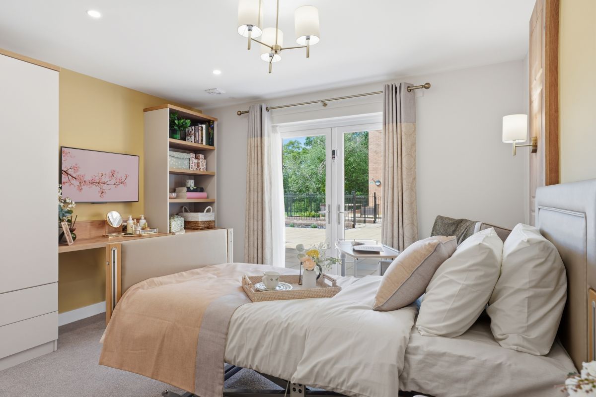 Comfortable bedroom at Heathview Rose care home, with fresh bedding and a tea tray.